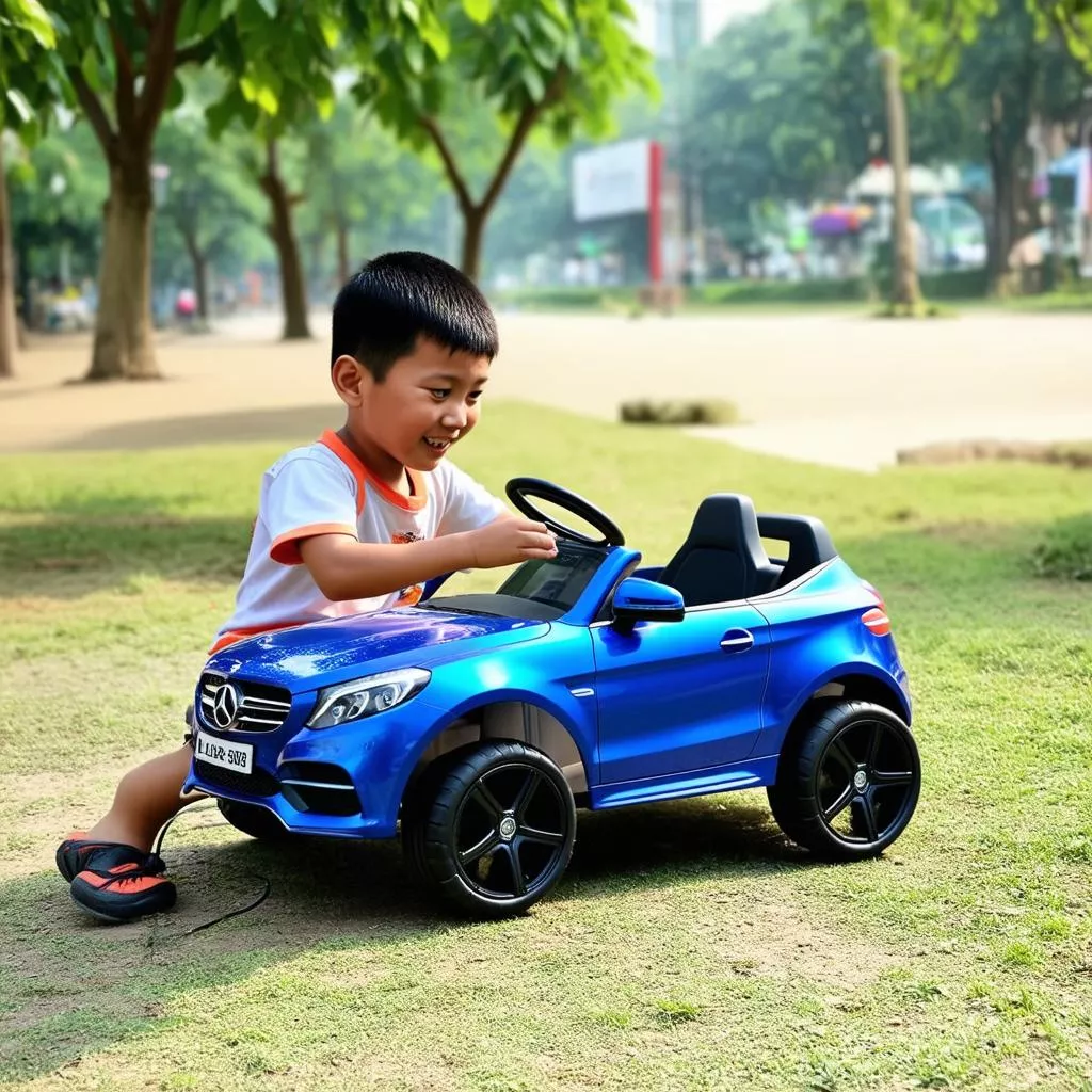 Boy playing with an electric car