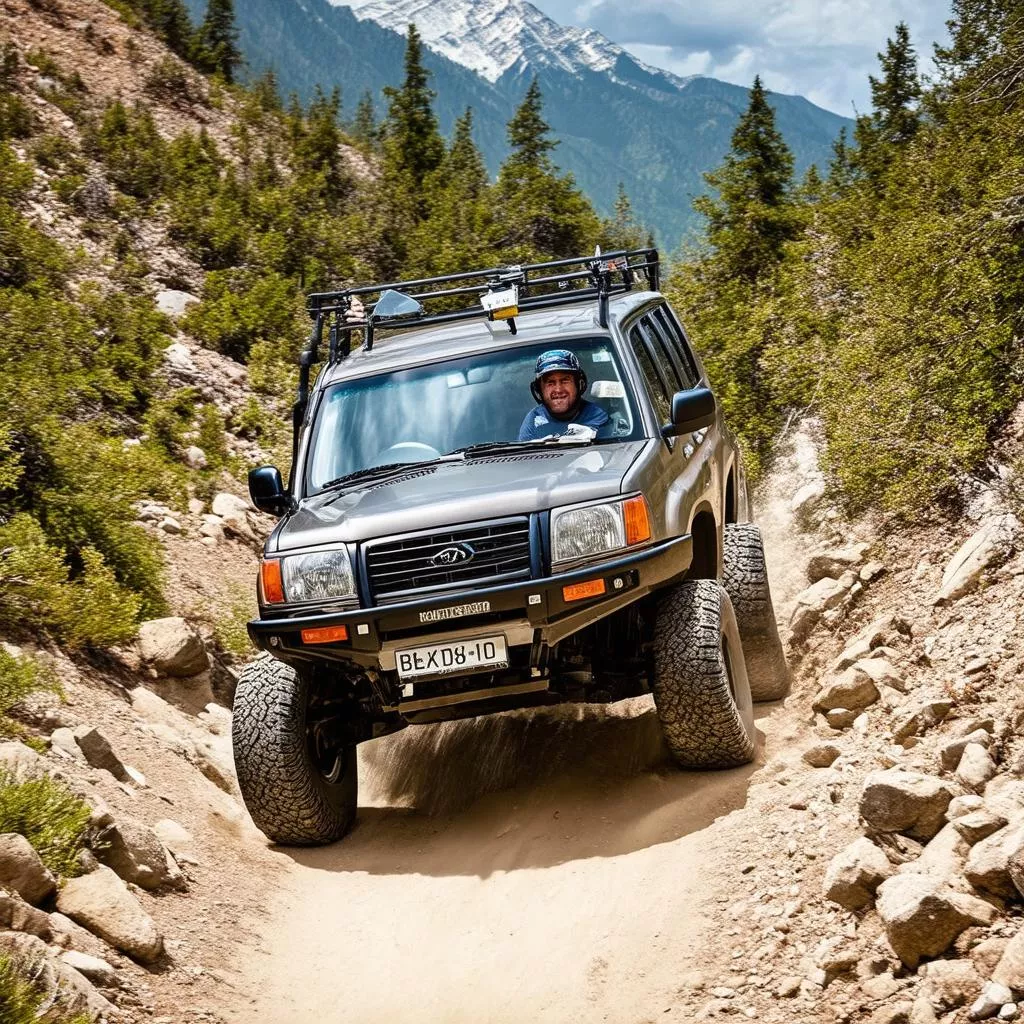 Man driving an off-road vehicle on a mountain trail