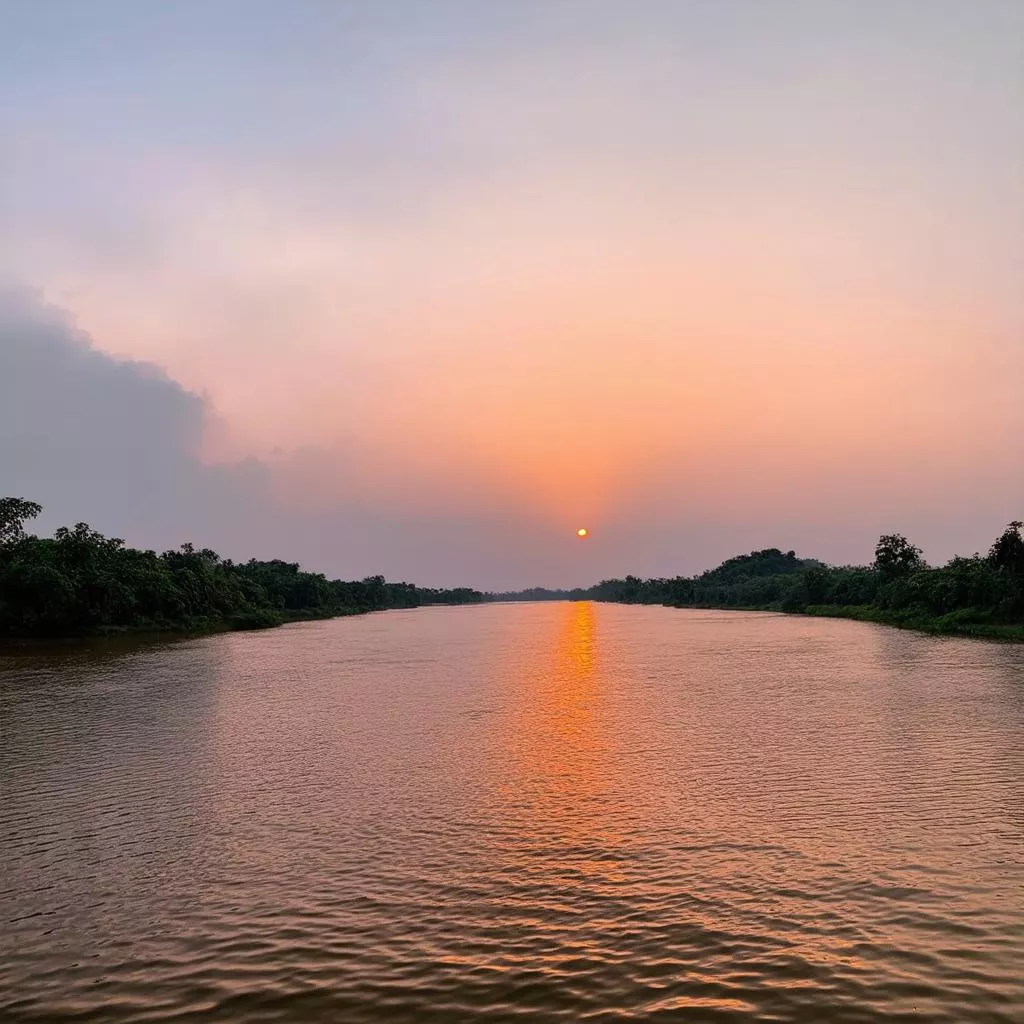 Sunset over the Hau River in Vietnam