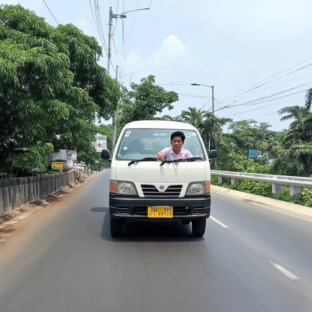 A person driving a van safely in Vung Tau
