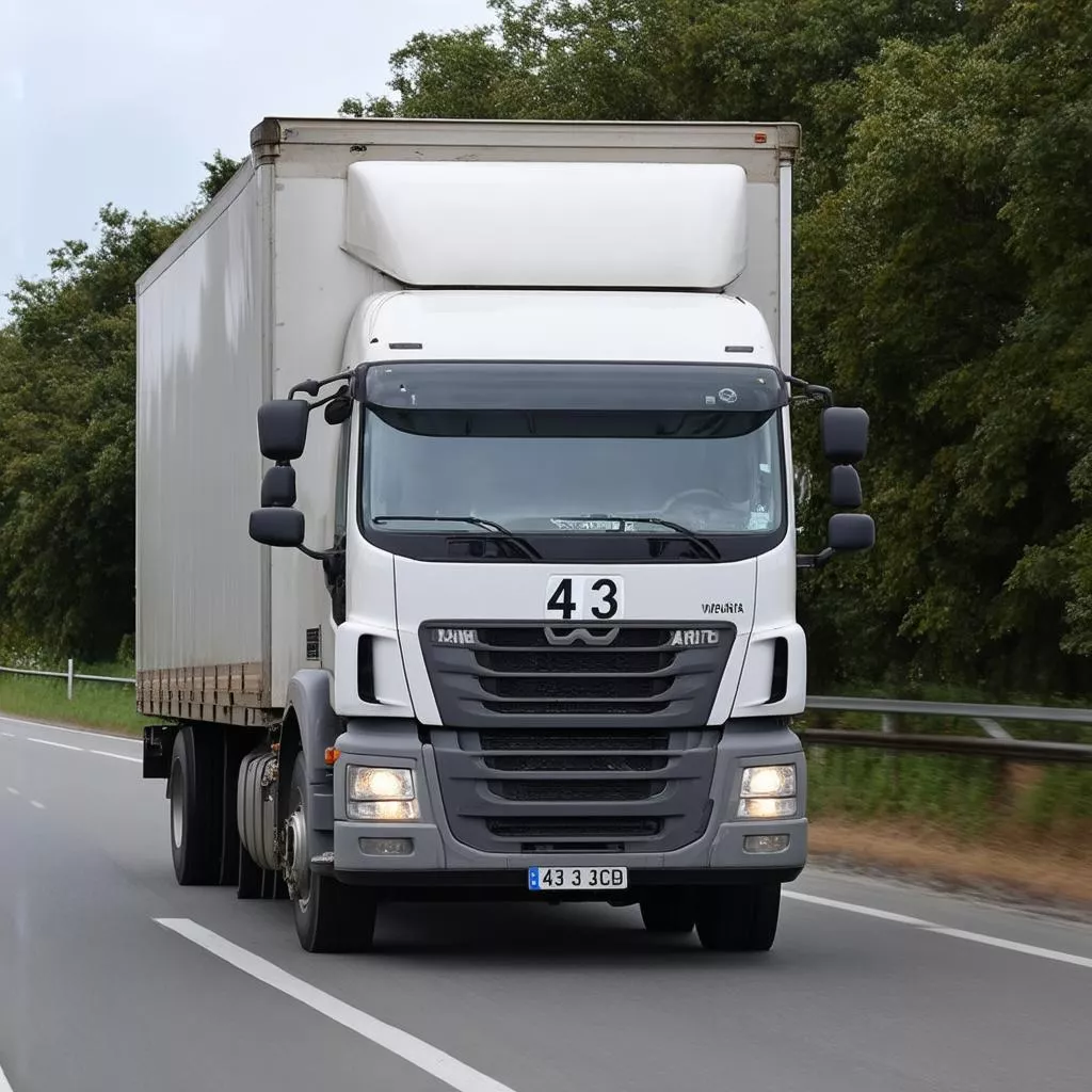 Truk dengan plat nomor 43 bergerak di jalan